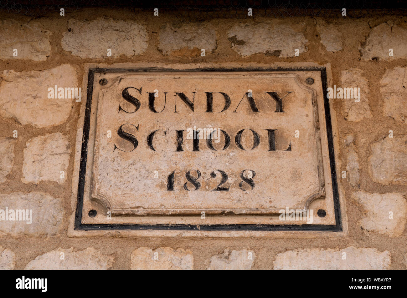 Sign on the former Sunday School, Main Street, Tingewick village, Buckinghamshire, England, UK Stock Photo