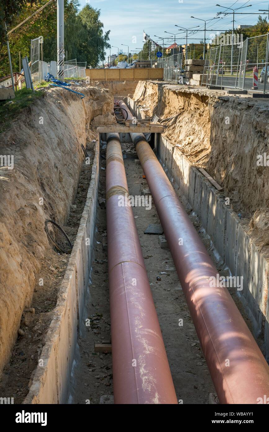Underground pipe installation. Steel, giant. Laying or replacement of underground  pipes. Installation of underground pipes. Utility infrastructure Stock  Photo - Alamy