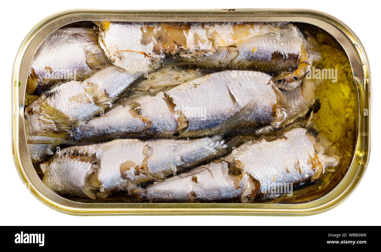Closeup view of opened can of smoked sardines in oil. Isolated over white background Stock Photo