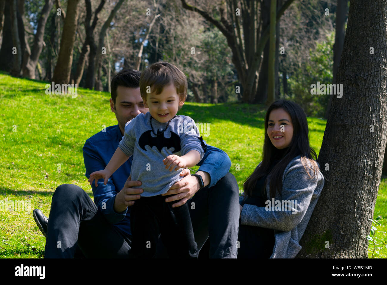 Happy family in the park Stock Photo - Alamy