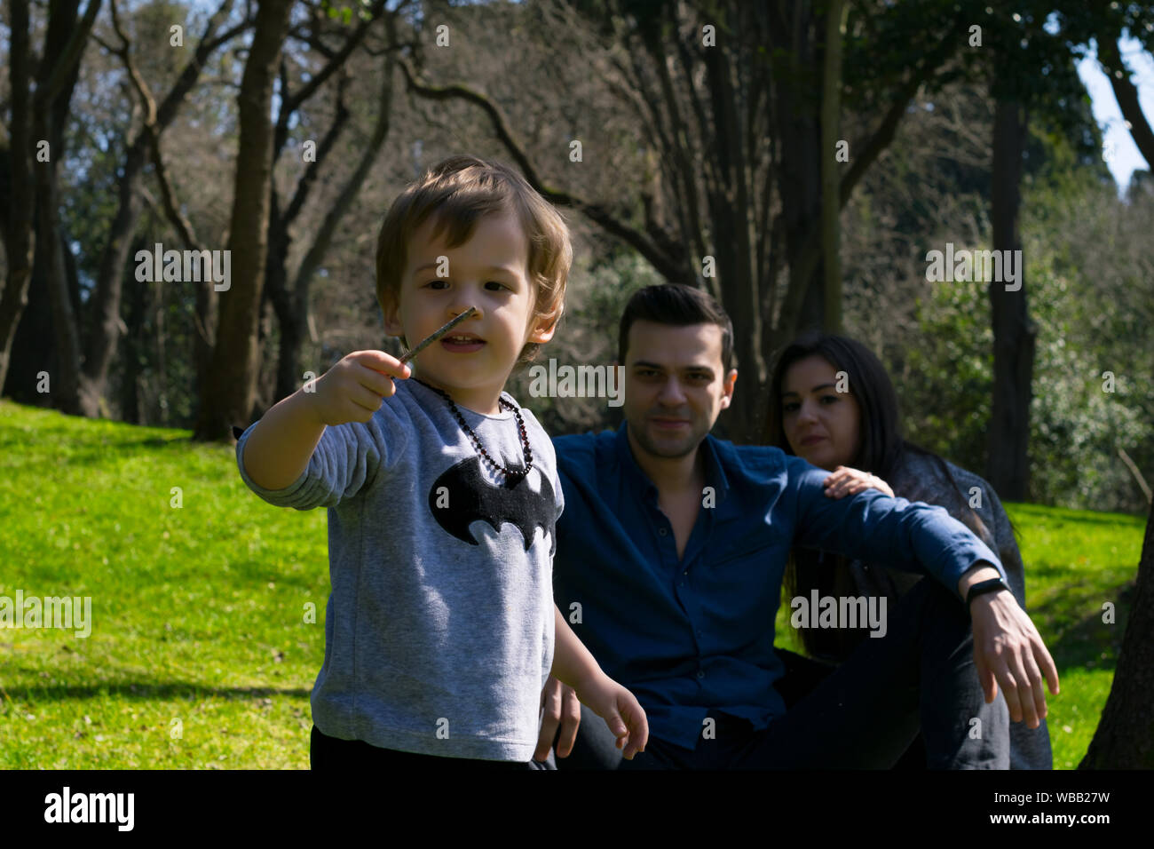 Happy family in the park Stock Photo - Alamy