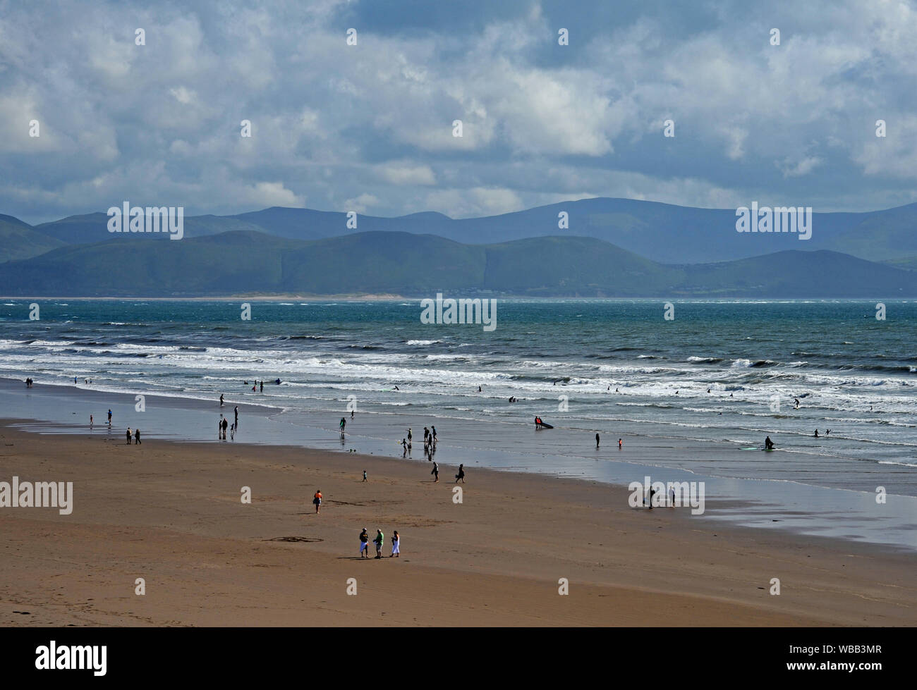 Inch Strand on the Dingle peninsular in County Kerry with waves breaking on the wide sandy beach. Stock Photo