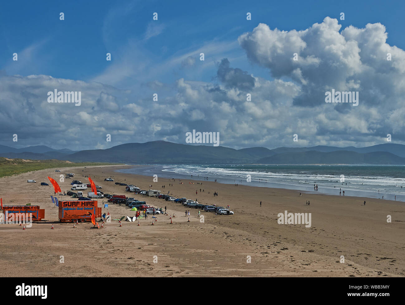 Inch Strand on the Dingle peninsular in County Kerry with waves breaking on the wide sandy beach. Stock Photo