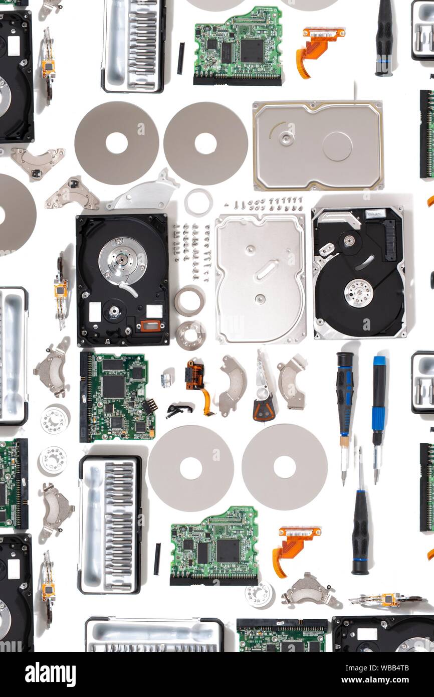 Disassembled hdd drive parts isolated on a white background. Stock Photo