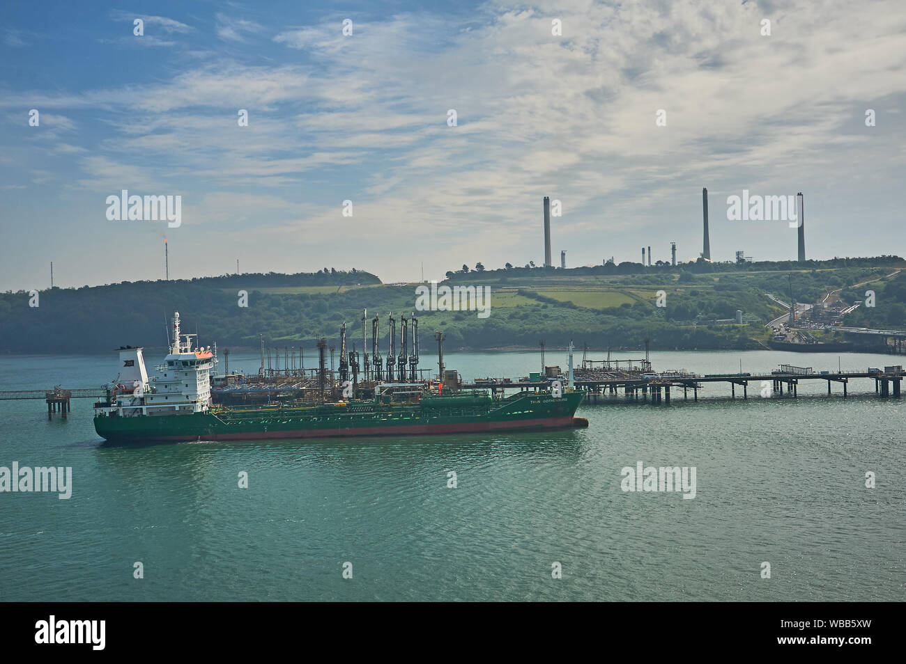 Oil and petro-chemical tankers moored to pontoons serving Milford Haven refineries in South Wales. Stock Photo