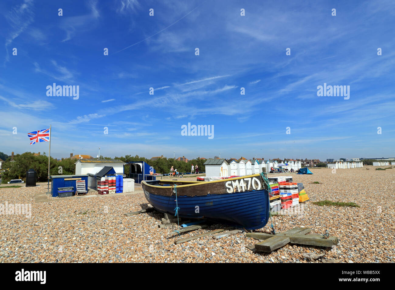 Fishing boat and stall selling freshly caught fish on the beach at