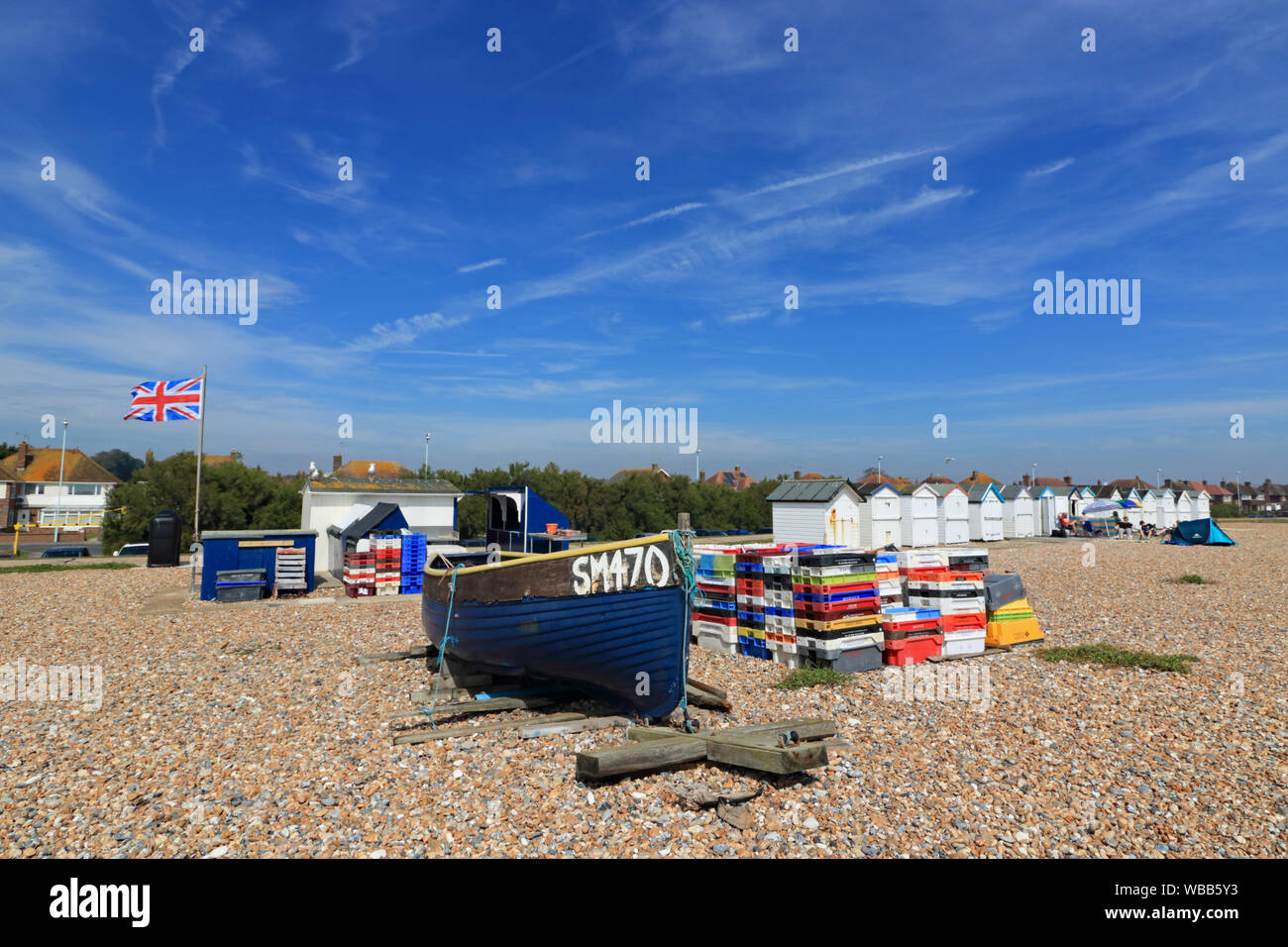 Fishing boat and stall selling freshly caught fish on the beach at