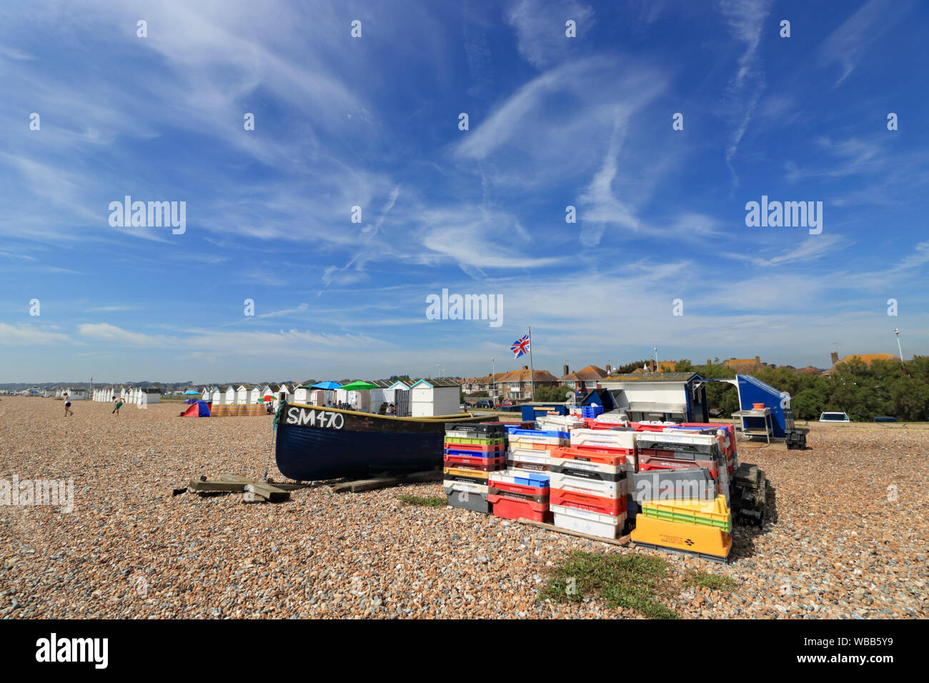 Fishing boat and stall selling freshly caught fish on the beach at