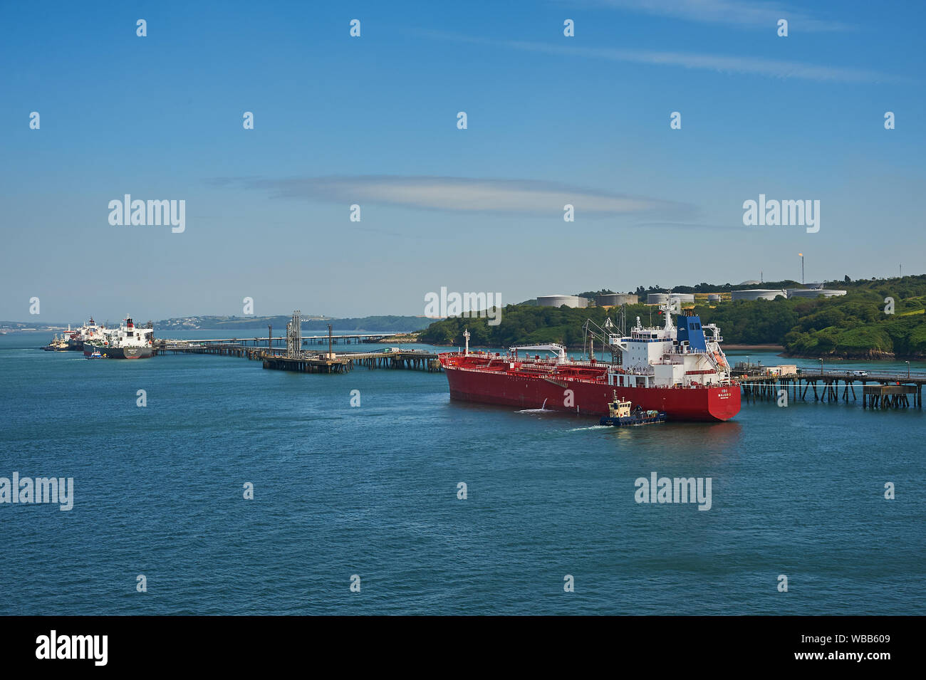 Oil and petro-chemical tankers moored to pontoons serving Milford Haven refineries in South Wales. Stock Photo