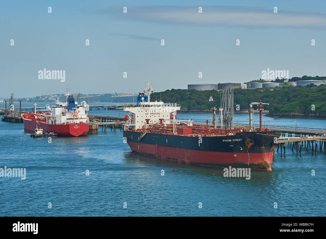 Oil and petro-chemical tankers moored to pontoons serving Milford Haven refineries in South Wales. Stock Photo