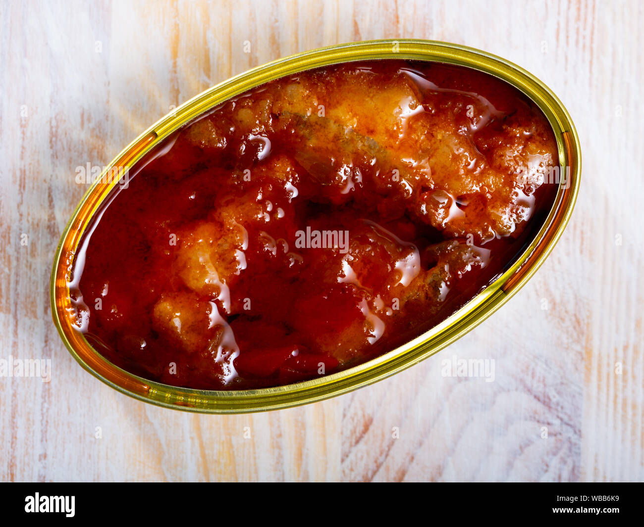 Image of pickled cod in tomato sauce in open tin can, nobody Stock ...