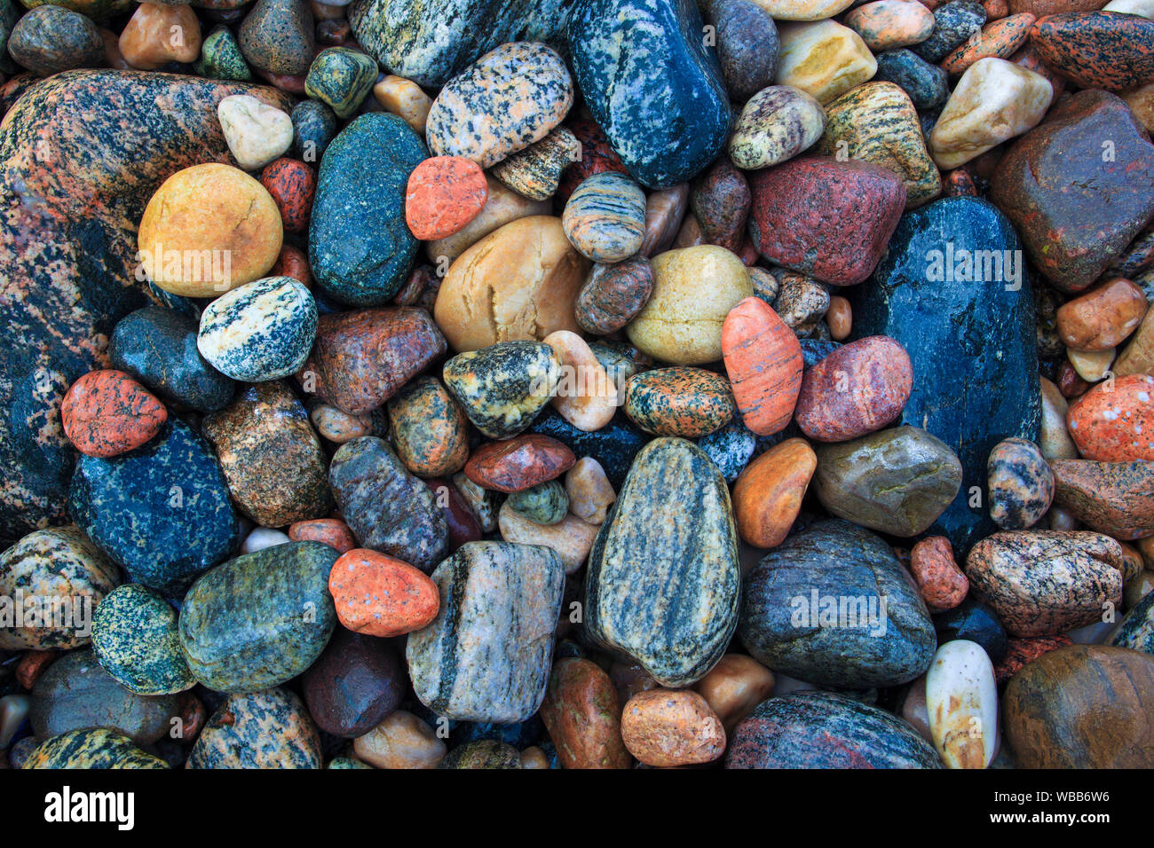 Wet, colorful stones on a beach, Scotland Stock Photo