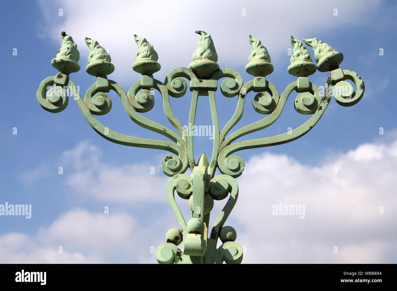 Menorah Jewish symbol in a grave in Milan Monumental Cemetery, Italy