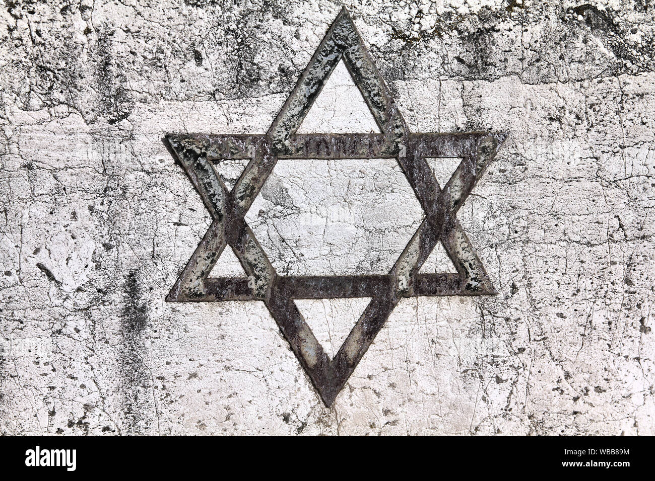 Star of David Jewish symbol on an old Hebrew grave in Milan, Italy
