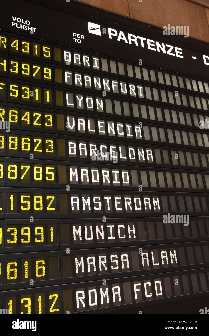 Departure schedule at an airport in Italy. Flights to Bari, Frankfurt,  Lyon, Valencia, Barcelona, Madrid, Amsterdam, Munich, Marsa Alam and Rome.  No a Stock Photo - Alamy