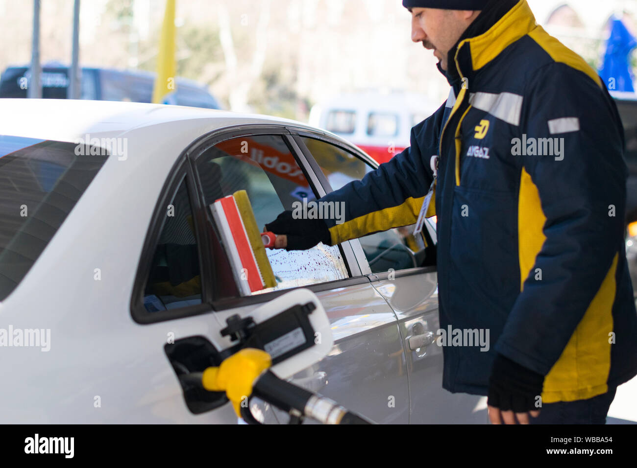 Hand wash car window Cleaning the car side glass. Windscreen washer at