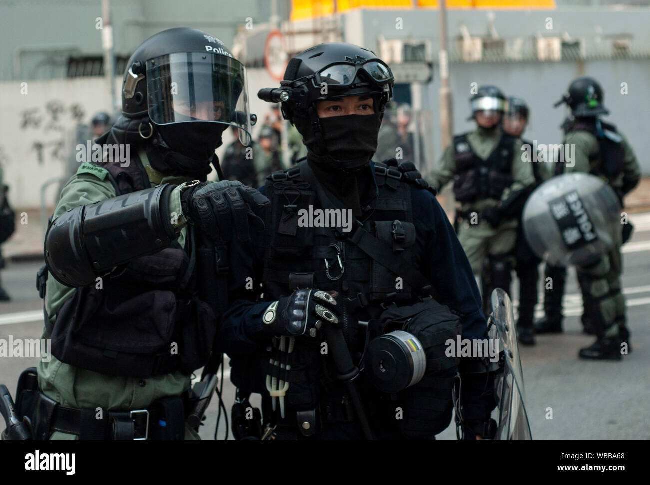 Hong Kong, China. 24th Aug, 2019. Riot police officers gather information in preparation to charge a large mass of pro-democracy protesters during the demonstration.Mass demonstrations continues for one more weekend in Hong Kong which began in June 2019 over a now-suspended extradition bill to China. Credit: SOPA Images Limited/Alamy Live News Stock Photo