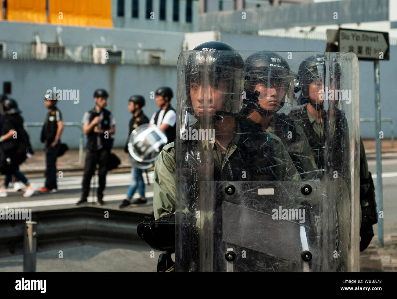Hong Kong, China. 24th Aug, 2019. Riot police officers stand on guard during the protest in Kwun Tong.Mass demonstrations continues for one more weekend in Hong Kong which began in June 2019 over a now-suspended extradition bill to China. Credit: SOPA Images Limited/Alamy Live News Stock Photo