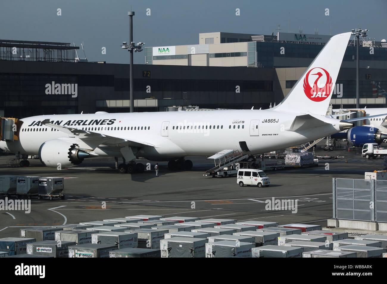 TOKYO, JAPAN - DECEMBER 5, 2016: Japan Airlines Boeing 777 parked at gate at Narita Airport of Tokyo. The airport is the 2nd busiest airport of Japan Stock Photo