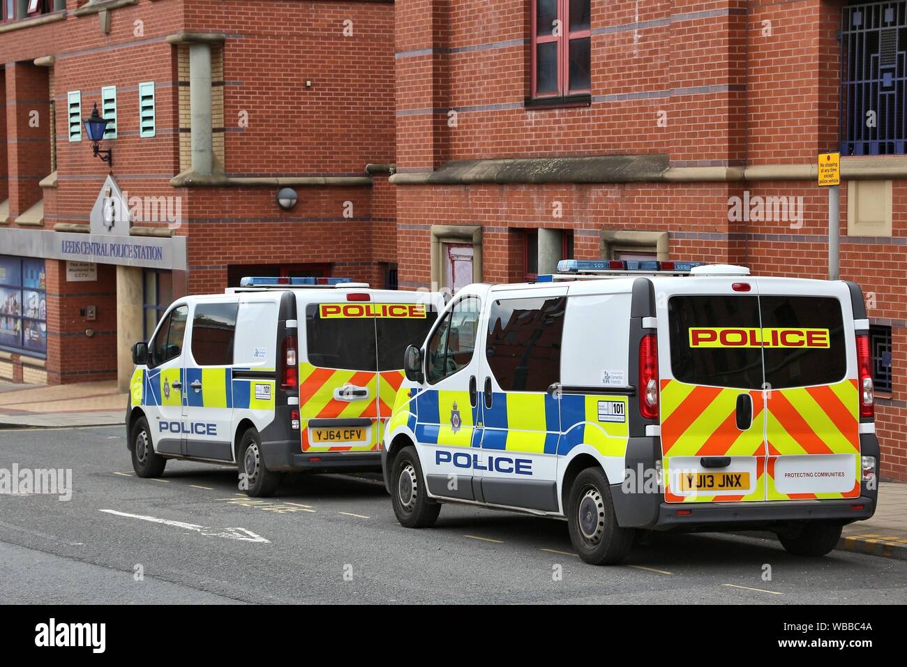 LEEDS, UK - JULY 12, 2016: Renault Traffic police vehicles parked next to Leeds Central Police Station in the UK. Stock Photo