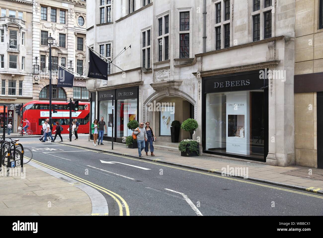 LONDON, UK - JULY 9, 2016: Shoppers visit fashion shops at Old Bond Street in London. Bond Street is a major shopping street in the West End of London Stock Photo