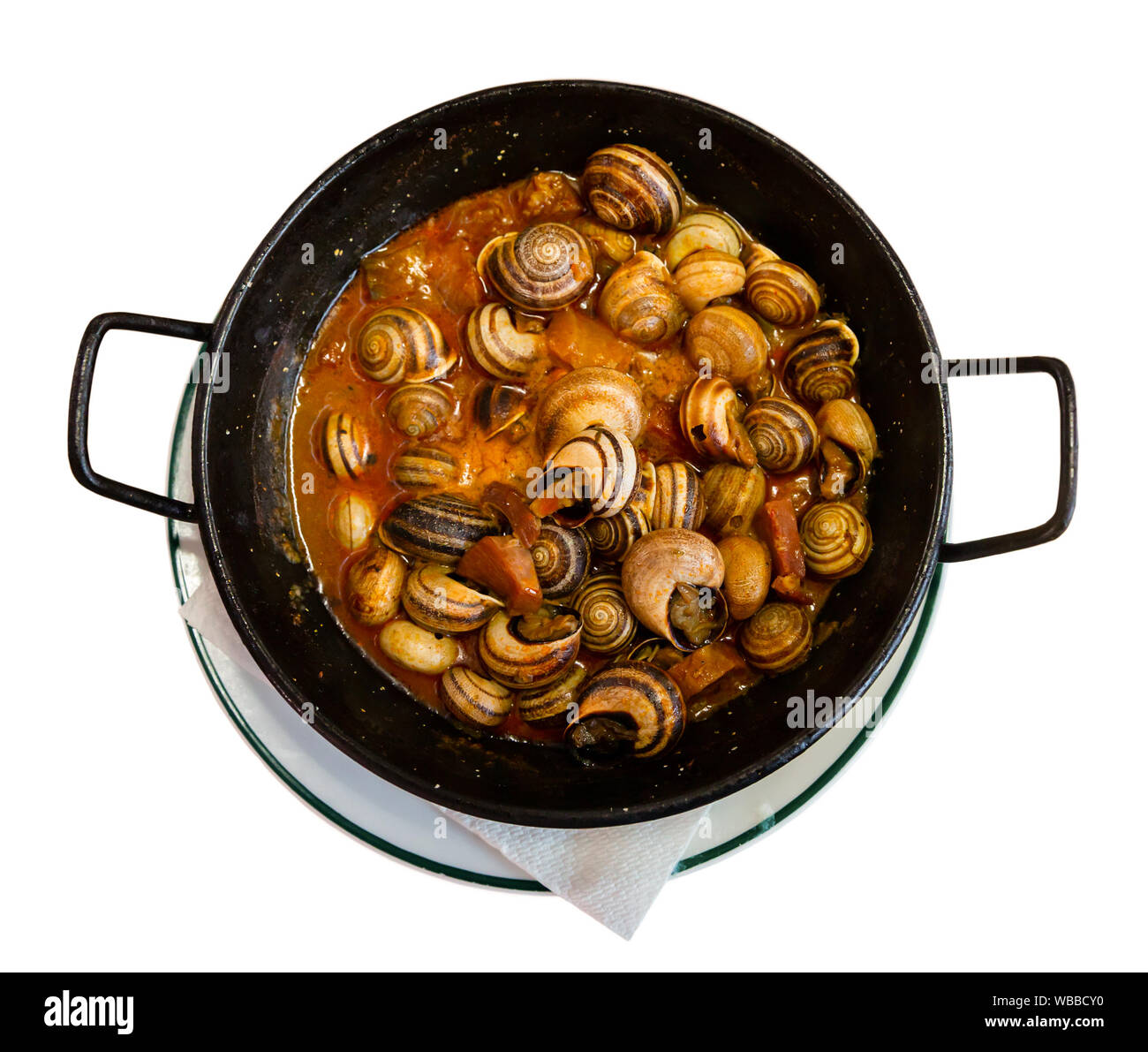 Top view of black frypan with traditional Spanish tapa Caracoles en