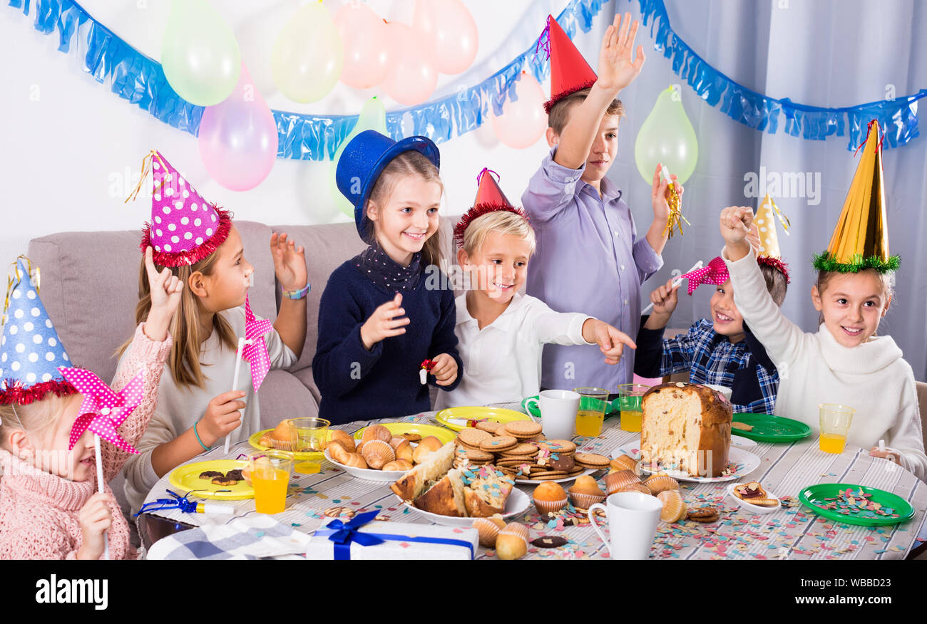 playing-children-having-good-time-during-friend-s-birthday-party-stock