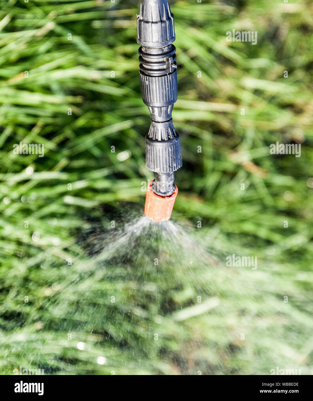 Spraying herbicide from the nozzle of the sprayer manual. Devices for