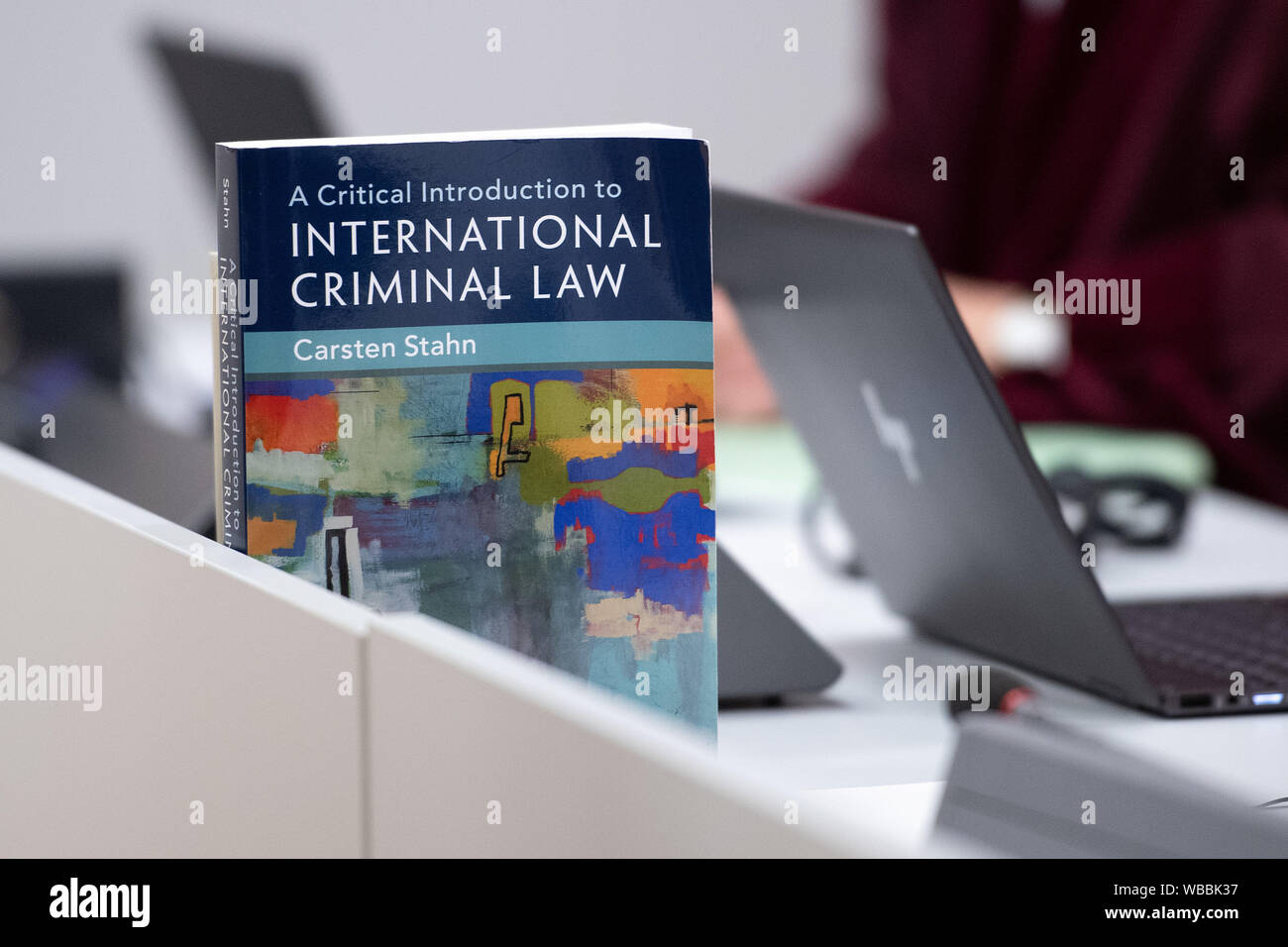 Duesseldorf, Germany. 26th Aug, 2019. During the proceedings against Sivatheeban B. in the Higher Regional Court, a textbook on international criminal law is on the table of the Federal Prosecutor's Office. The man from Sri Lanka is accused of war crimes. According to the court, the 37-year-old, as a member of the terrorist organisation 'Liberation Tigers of Tamil Eelam (LTTE)', also participated in the execution of soldiers of the Sri Lankan government army. Credit: Marius Becker/dpa/Alamy Live News Stock Photo