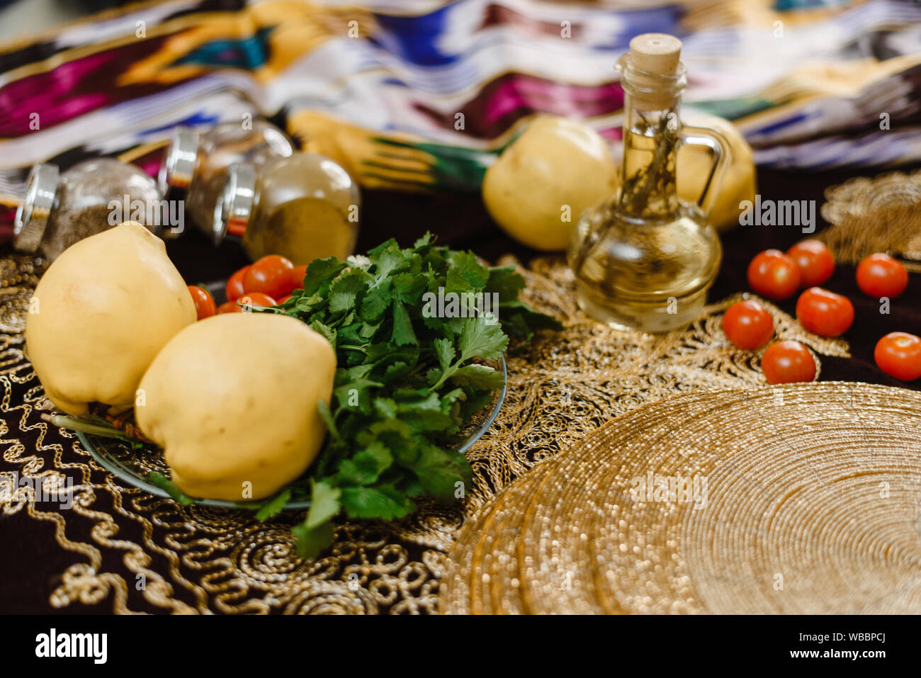 Quince Fruits On A Table Decorated With Oriental Fabrics With