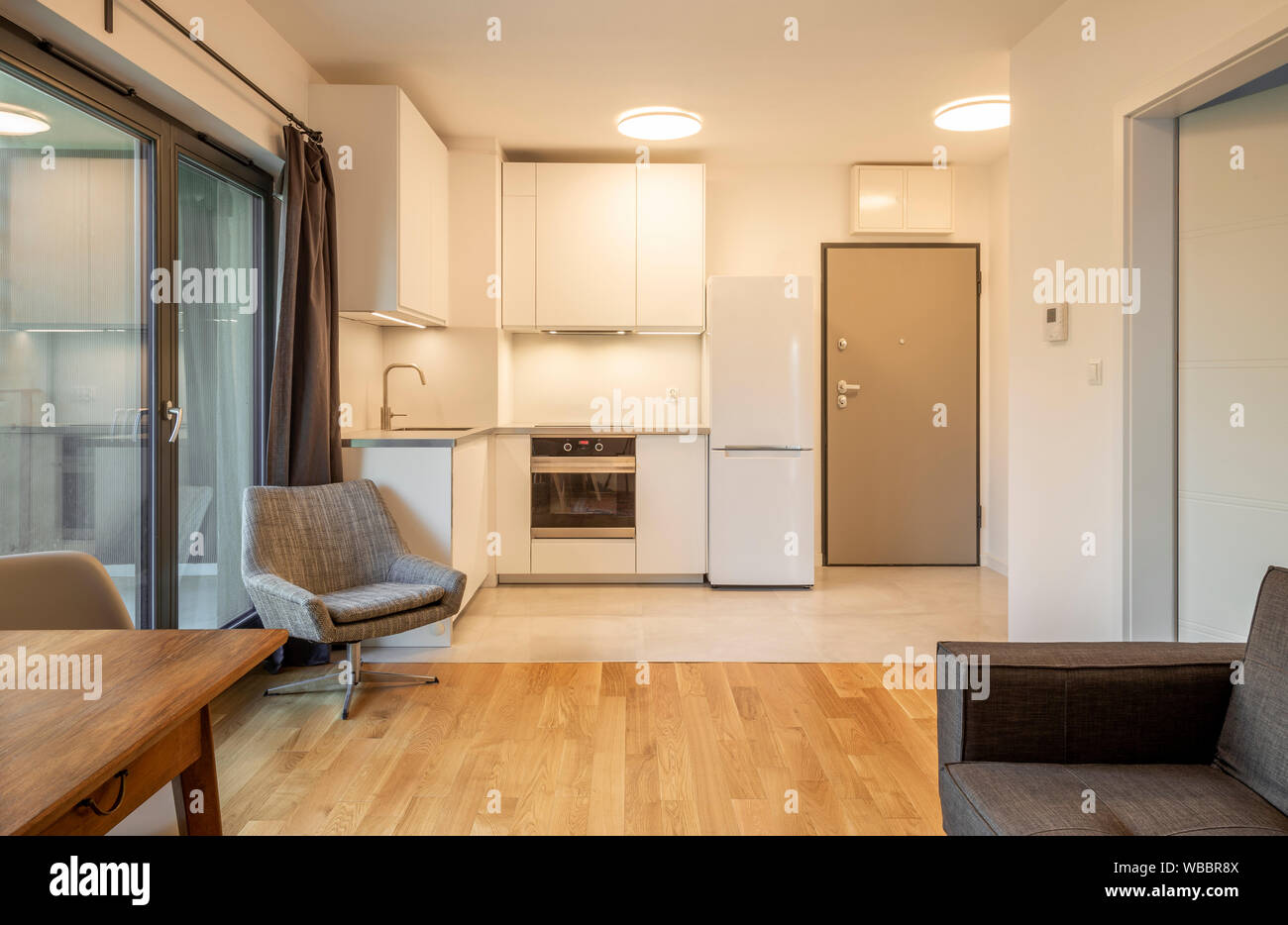 Interior of a modern micro apartment with living room and kitchenette Stock Photo