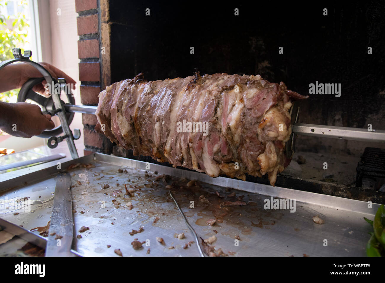 Traditional Turkish Oltu Cag Crochet Shish Kebab doner grilled in wood fired oven. Famous yatik doner kebab from Erzurum cuisine in restaurant Stock Photo