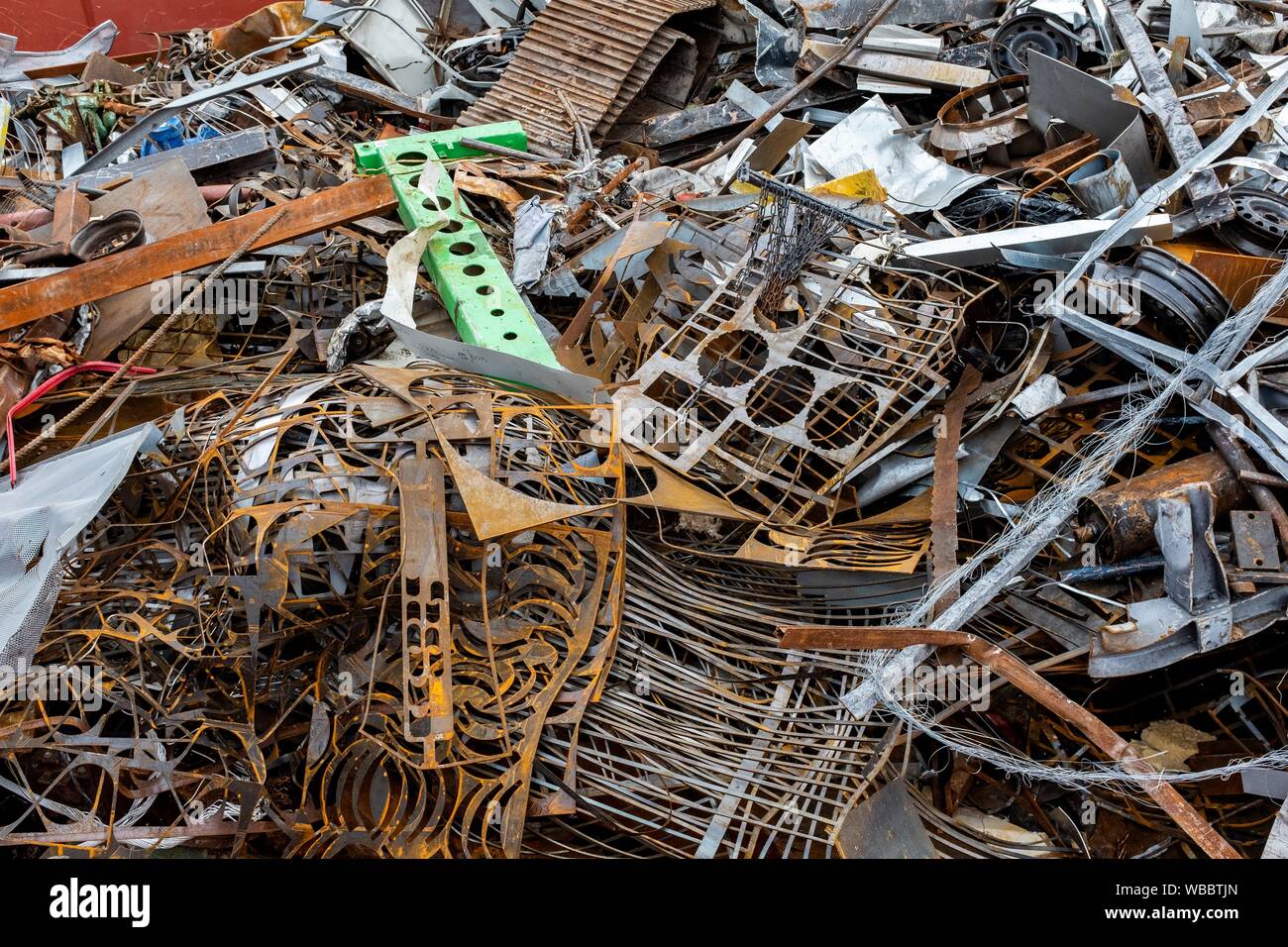 Rotterdam, Netherlands. Inland Barge filled with a huge pile of used scrap metal to be recycled