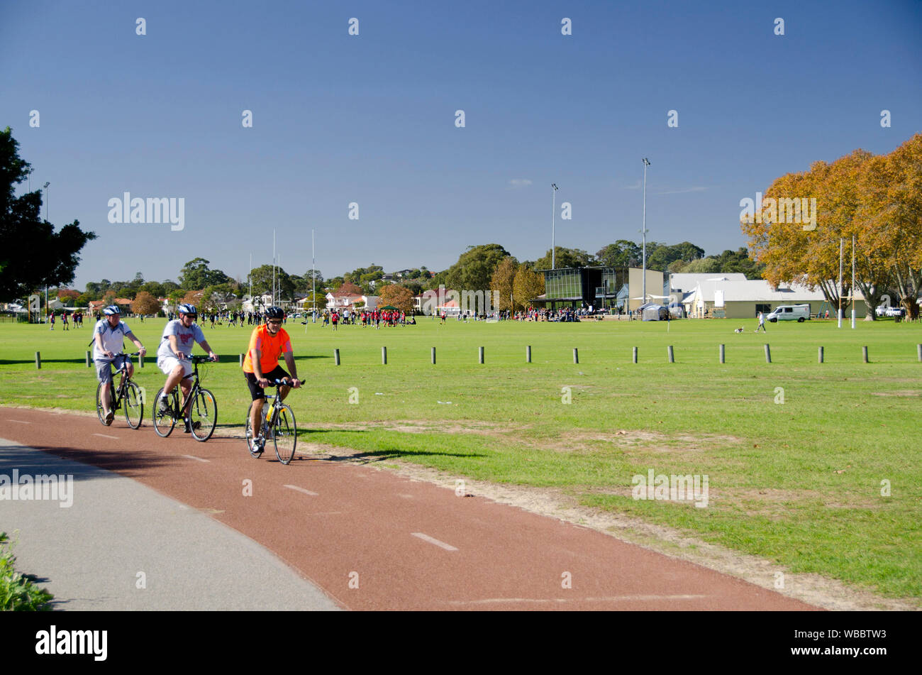 Bicycle path and cyclists in Tompkins Park. Perth has an extensive