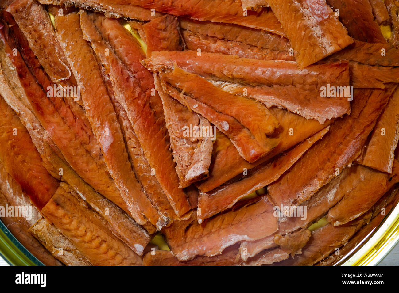 Closeup view of traditional Spanish tinned anchovy fillets in oil Stock