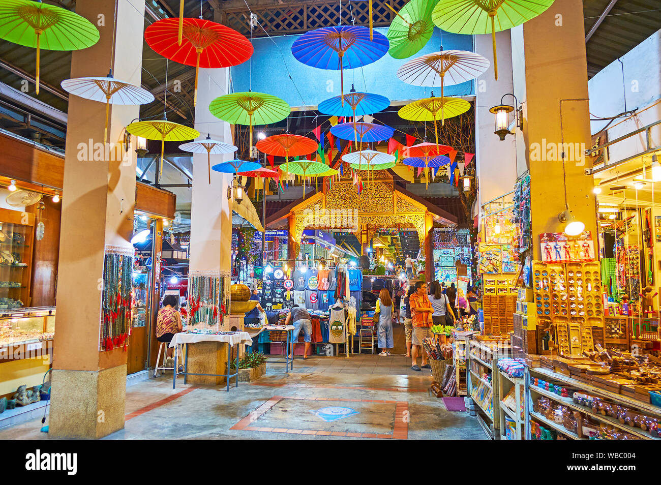 CHIANG MAI, THAILAND - MAY 2, 2019: The hall of Kalare Night Market is decorated with brightly colored Oriental umbrellas, on May 2 in Chiang Mai Stock Photo