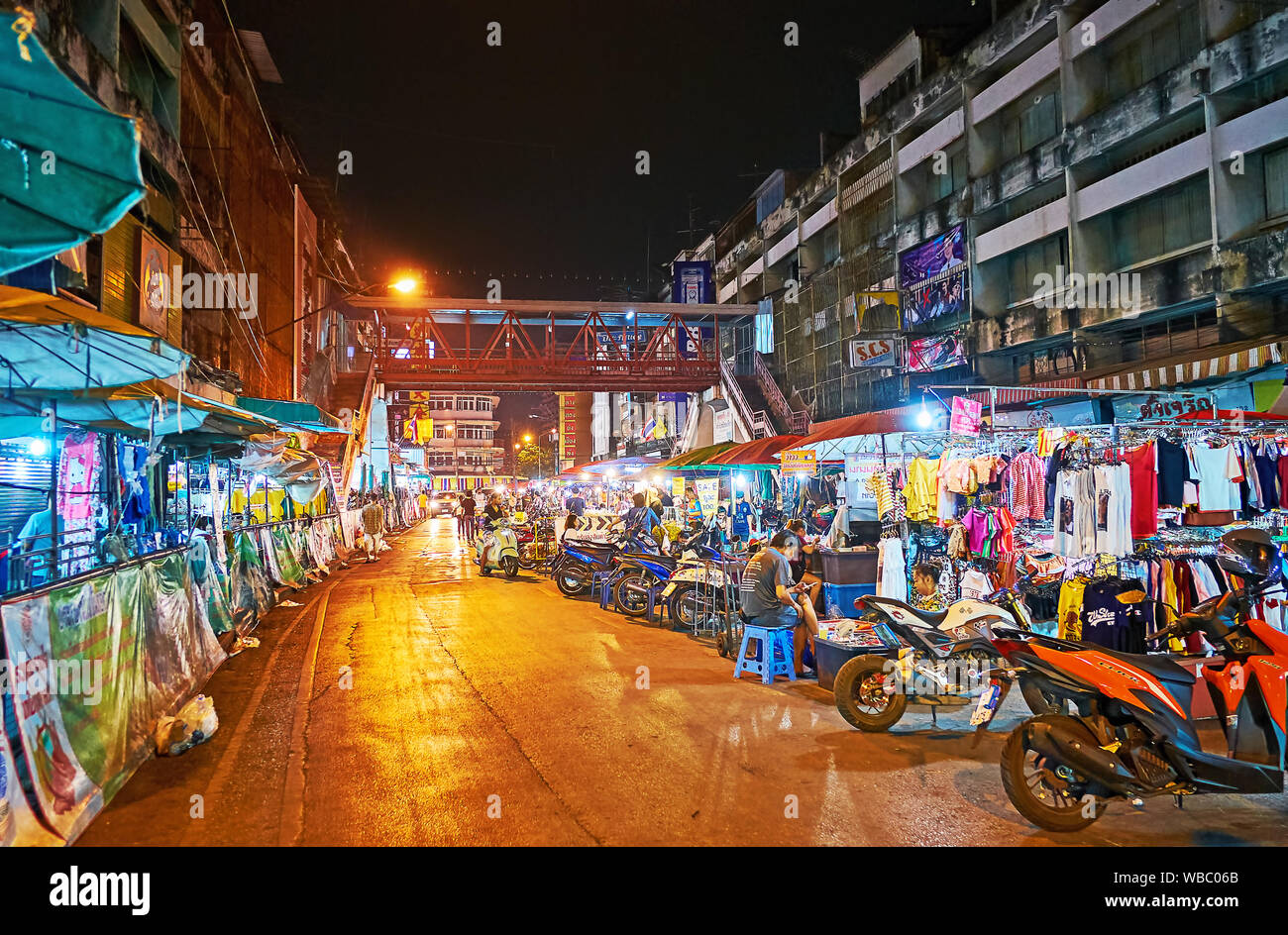 CHIANG MAI, THAILAND - MAY 2, 2019: The alley with numerous garment stalls of Warorot Market stretches along the Chiang Moi Road, on May 2 in Chiang M Stock Photo