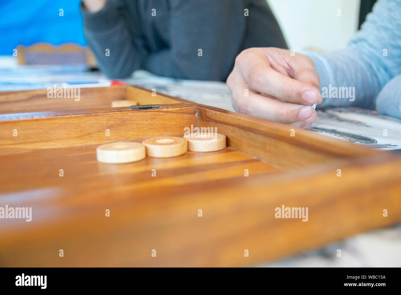 Man holding dice in hand Stock Photo