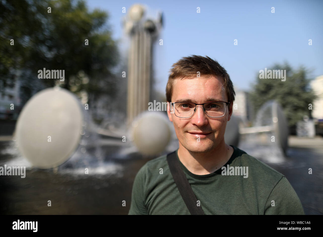 Cologne, Germany. 26th Aug, 2019. Georg Lonscher, organizer of the holiday program at Ebertplatz, sits in front of the fountain. After an argument on the Ebertplatz in Cologne with a dead man, the investigation into the background continues. Credit: Oliver Berg/dpa/Alamy Live News Stock Photo