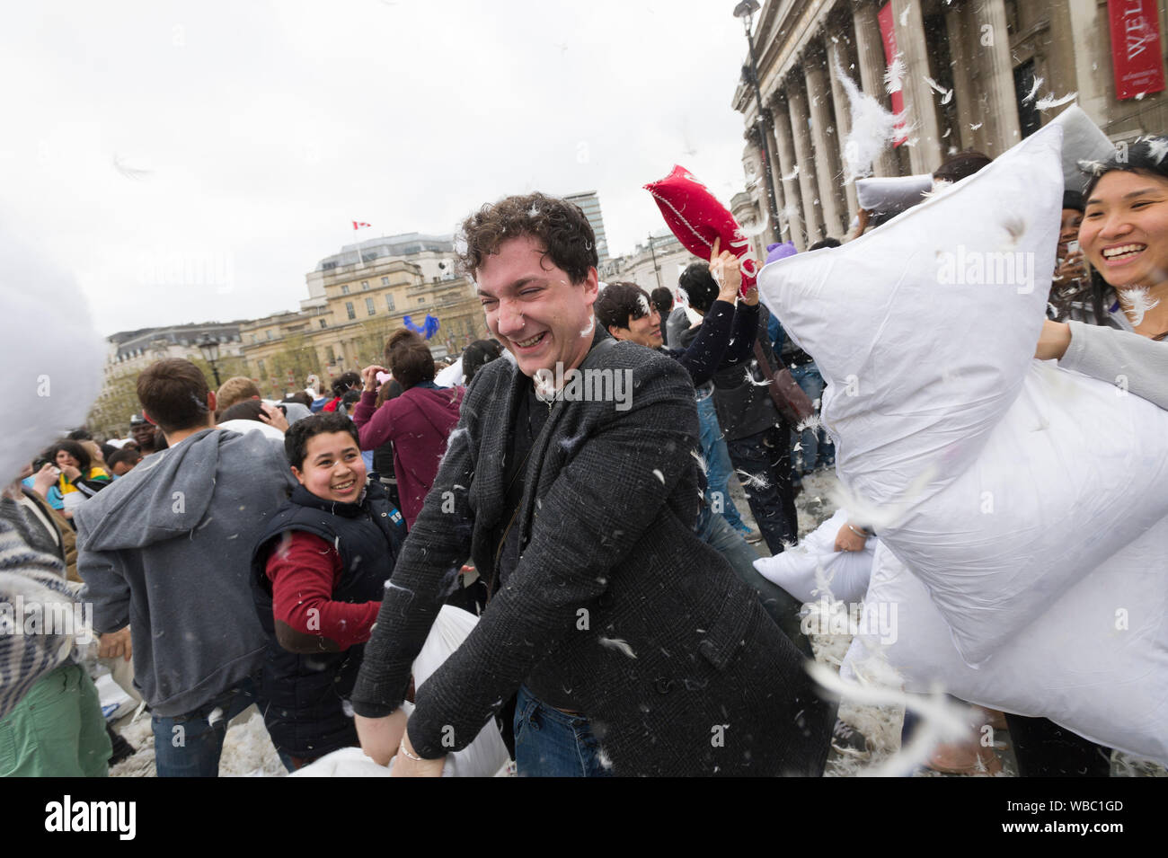 People taking part in, International Pillow Fight Day, Trafalgar Square, London, Britain. Pillow fights are happening in different city all round the Stock Photo