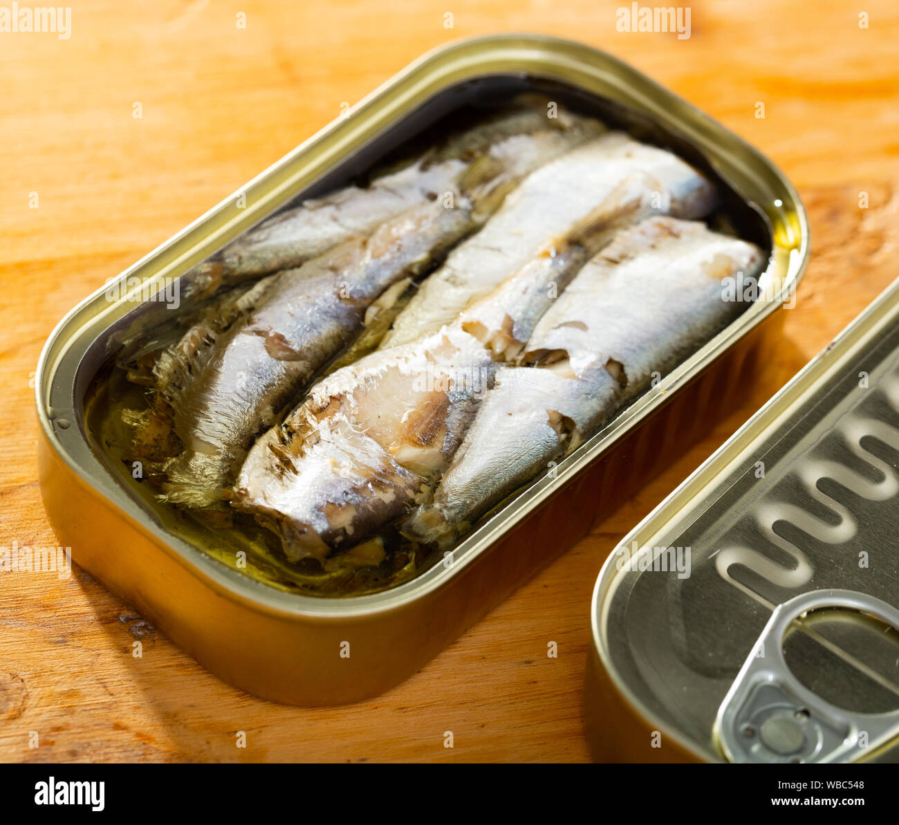 Tin can with smoked sprats, sardines, closeup Stock Photo Alamy