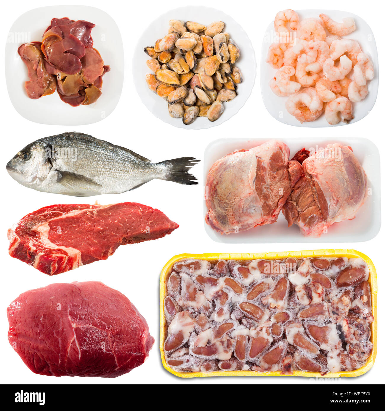 Collection of various uncooked meat and fish products on white