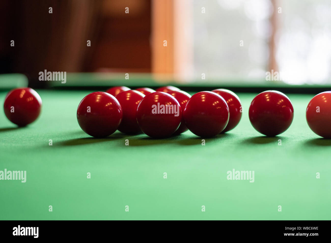 Red balls on a billiards table. Stock Photo