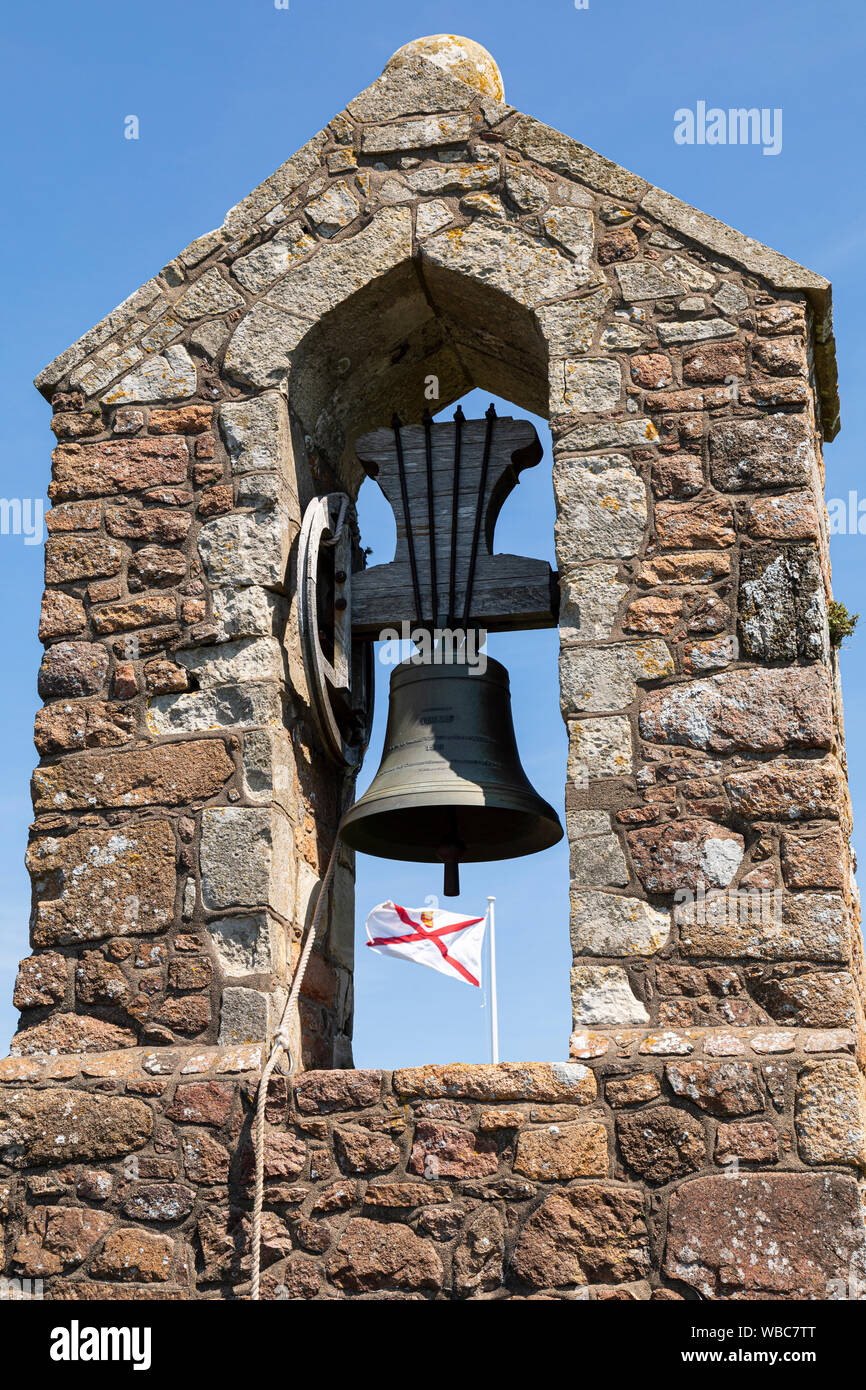 The bell tower and Jersey flag flying above Mont Orgueil Castle, Gorey, Jersey Stock Photo