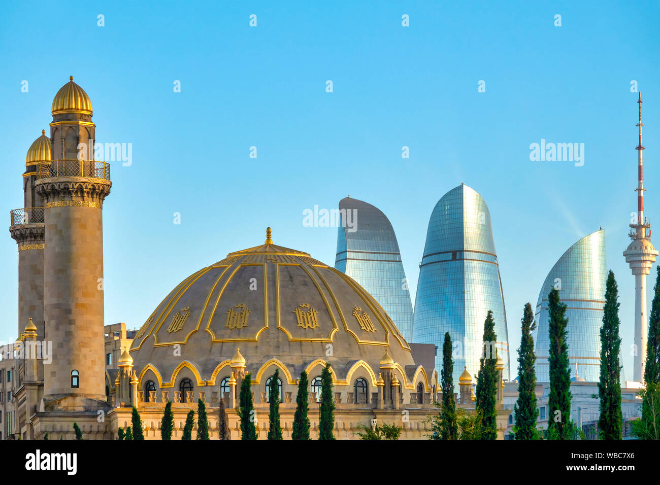 Taza Pir Mosque and Flame Towers, Baku, Azerbaijan Stock Photo