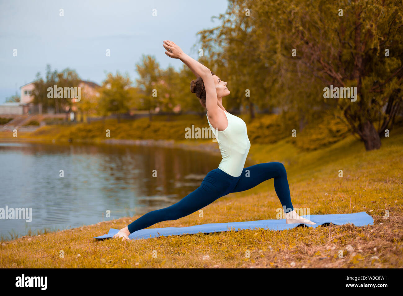 Slim brunette girl goes in for sports and performs yoga poses in Slim brunette girl goes in for sports and performs yoga poses in