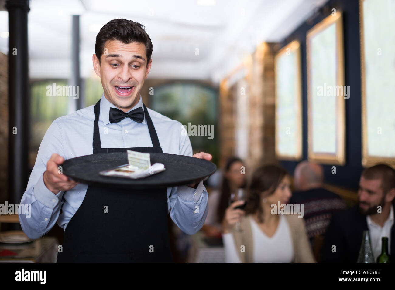 Man in apron serving tray hires stock photography and images Alamy