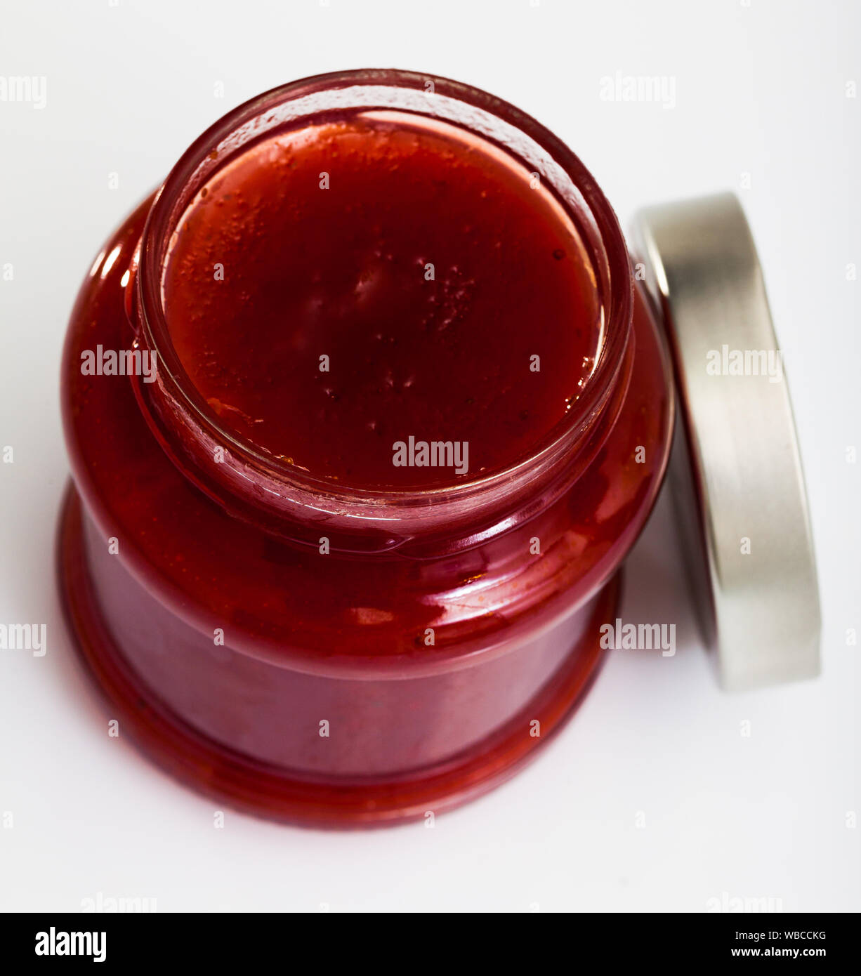 Strawberry jam in a glass jar Stock Photo - Alamy