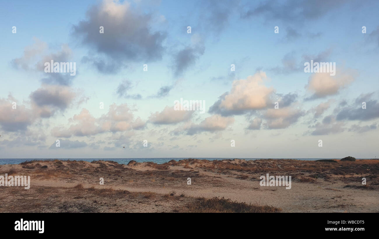 sunset sky and beautiful clouds over the sea Stock Photo - Alamy