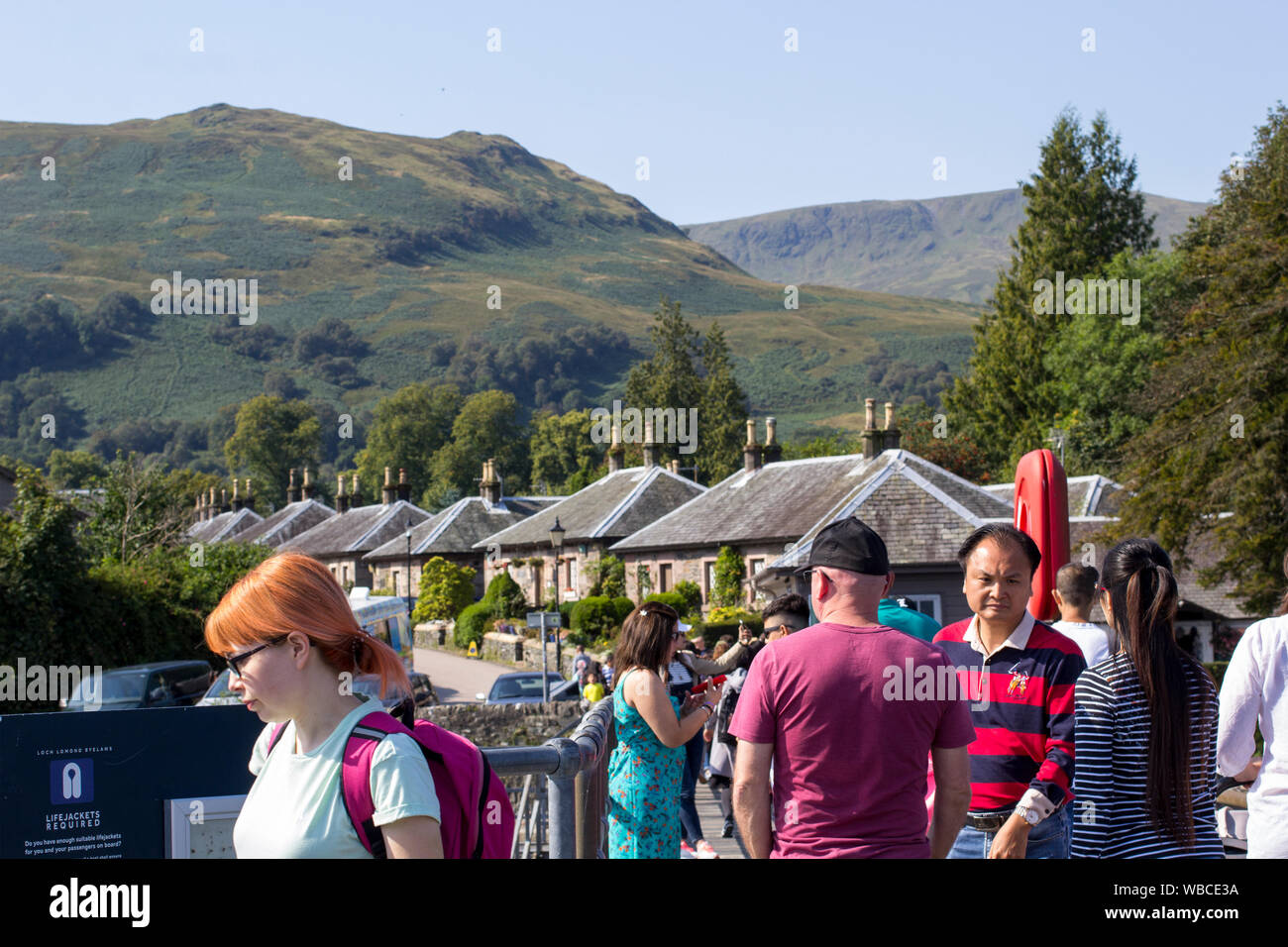 Luss, Argyll & Bute, Scotland, August, 25, 2019: Hundreds of people visit a small picturesque village on the west bank of Loch Lomond to sunbathe and Stock Photo